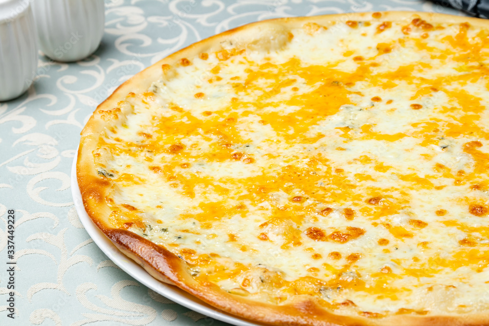 Pizza Quattro formaggi on white plate Pizza Quattro formaggi on white plate