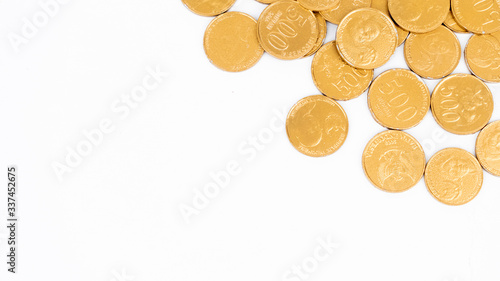 Top view of golden coins with copy space