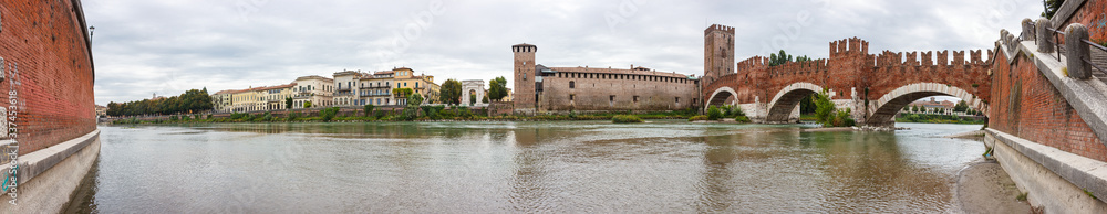 Ponte  Scaligero bridge, Castelvecchio castle and the area adjacent to them. View from the left bank of Adige river in Verona, Italy