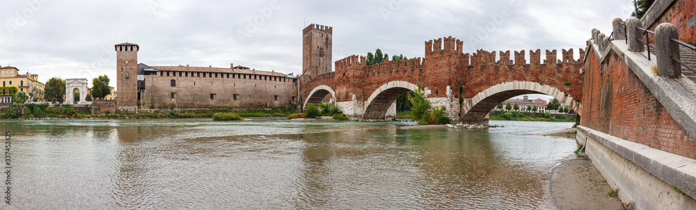Ponte  Scaligero bridge, Castelvecchio castle and the area adjacent to them. View from the left bank of Adige river in Verona, Italy