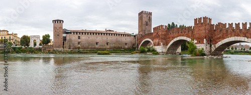 Ponte Scaligero bridge, Castelvecchio castle and the area adjacent to them. View from the left bank of Adige river in Verona, Italy