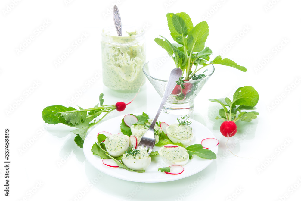 boiled stuffed eggs with green cheese filling with arugula leaves and radish boiled stuffed eggs with green cheese filling with arugula leaves and radish
