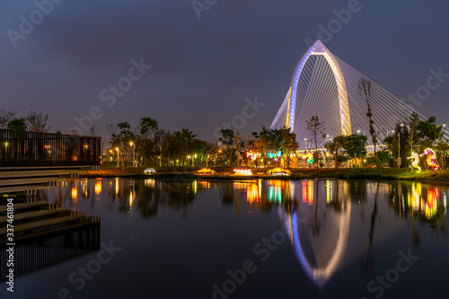 Nightscape of new landmark Konan Ai-Qin Bridge in Taichung City, Taichung Central Park at the Xitun District Shuinan Economic and Trade Area. The second largest park in Taiwan photo