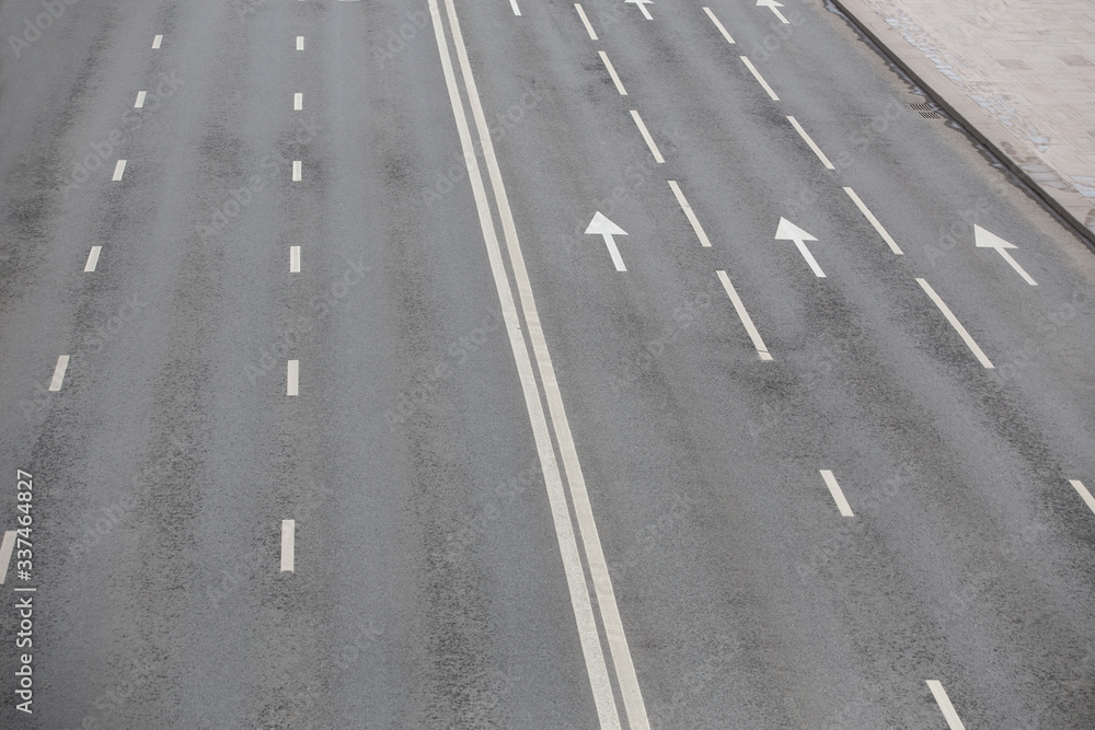 Multi-lane highway with markings on asphalt