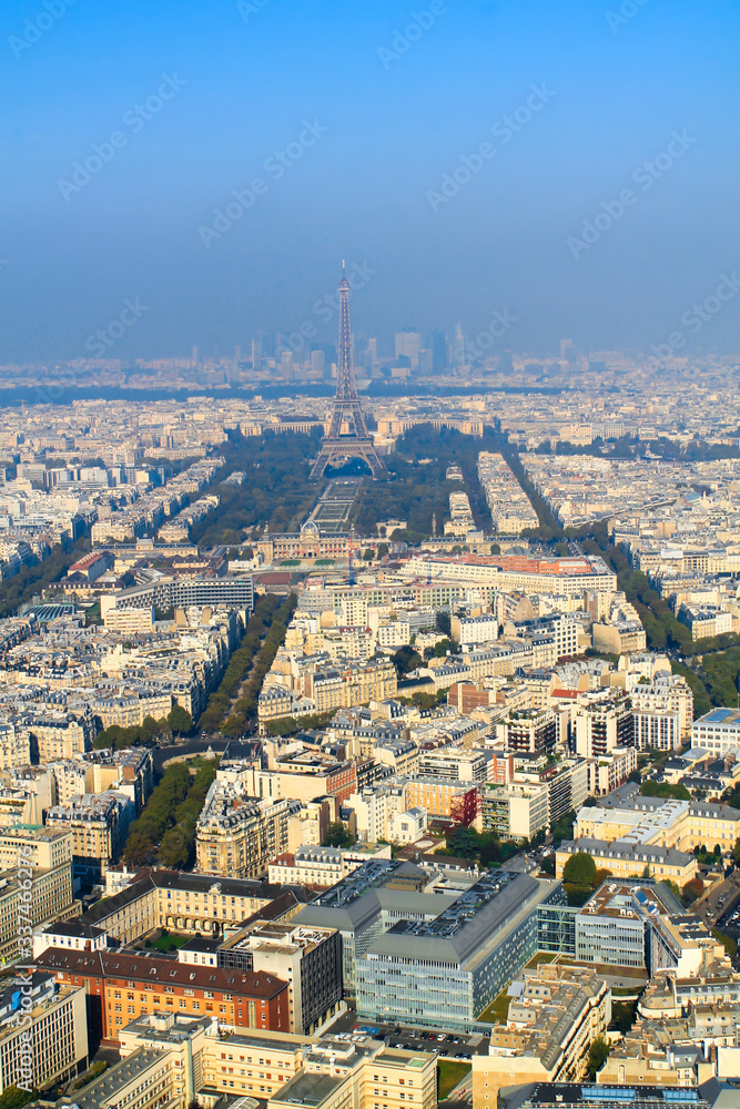 Cityscape of Paris, aerial view of Paris with the main attraction of the Eiffel Tower in foggy weather in the morning in summer. Background. France