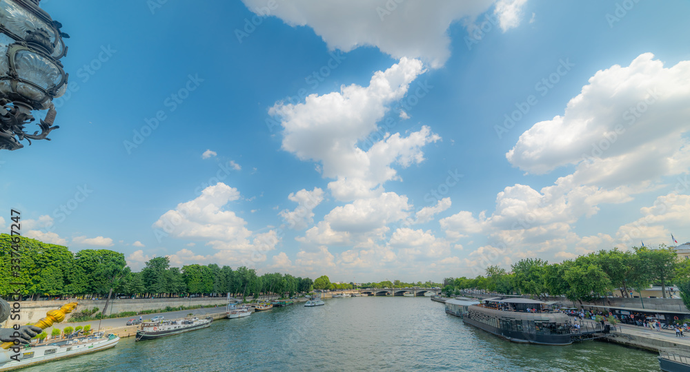 Fototapeta premium Clouds over Seine river in Paris