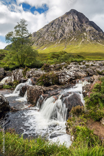 glencoe, mountain and waterfall in portrait format. Scotland