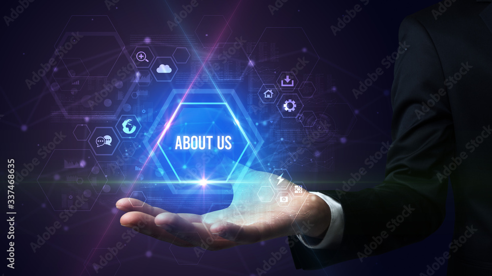 Man hand holding ABOUT US inscription, social media concept Man hand holding ABOUT US inscription, social media concept