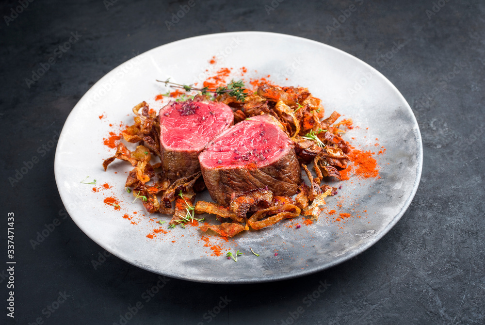 Barbecue dry aged beef fillet medallion steak natural with fried onion