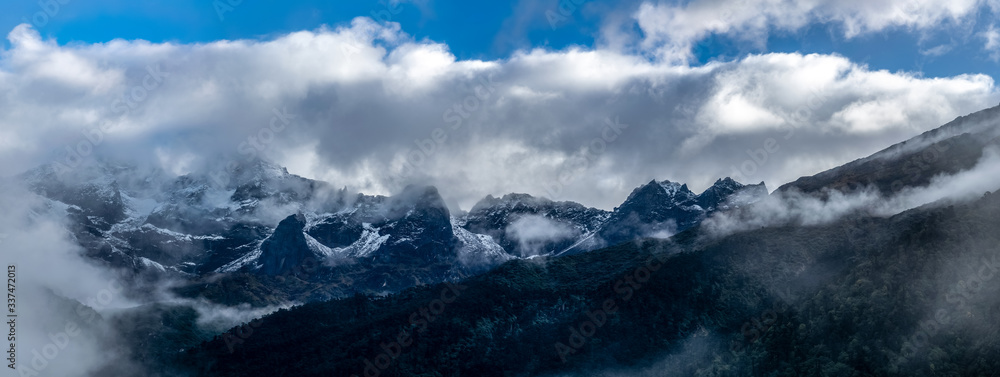 a beautiful mountain panorama view with fog and clouds a beautiful mountain panorama view with fog and clouds