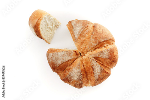 Foto Round bread sliced on a white background. Isolated