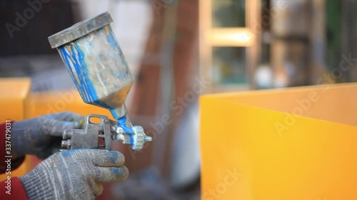 Wallpaper Mural Yellow hives for apiary. Work on painting a wooden product. Spray paint on furniture surface. Creation of an insect house in the workshop. Air pressure pushes out oil paint. Manual work in the garage  Torontodigital.ca