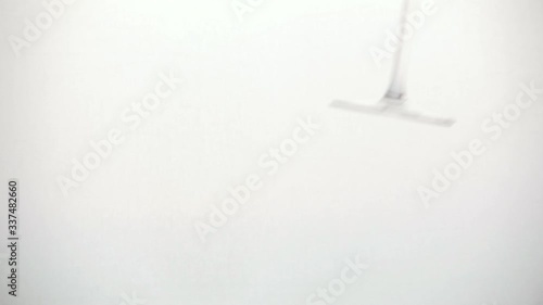 pours champagne slowly into a glass