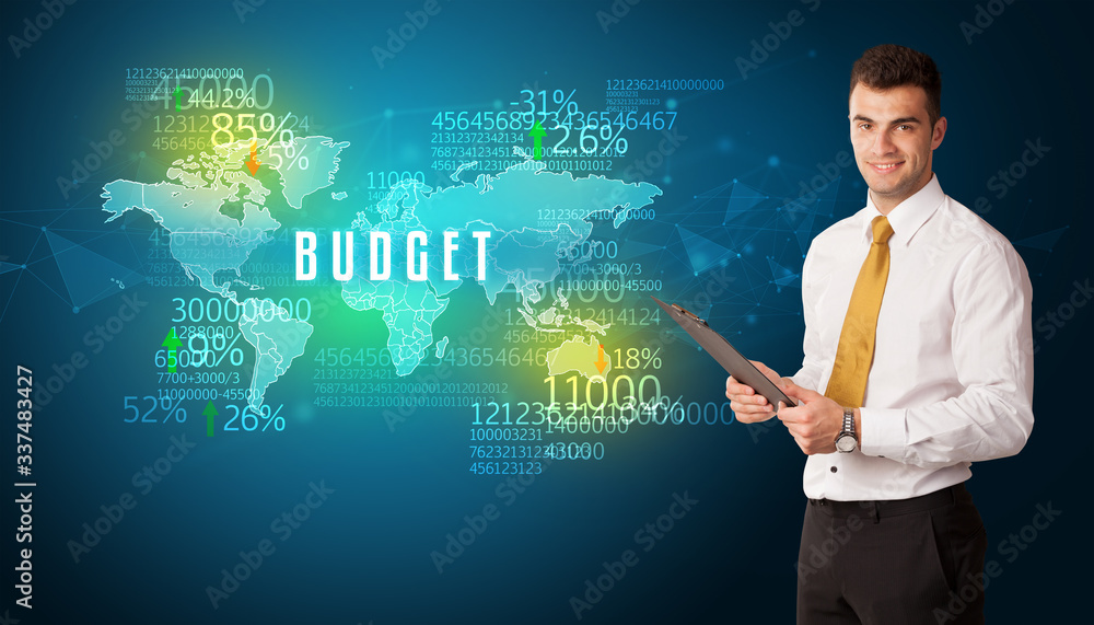 Businessman in front of a decision with BUDGET inscription, business concept Businessman in front of a decision with BUDGET inscription, business concept