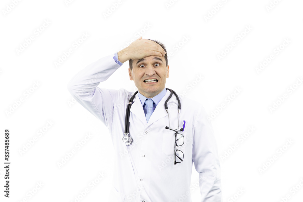 Middle-aged handsome doctor in white coat and stethoscope looking frustrated and shocked covering forehead with hand because of mistake, isolated white background, medicine concept Middle-aged handsome doctor in white coat and stethoscope looking frustrated and shocked covering forehead with hand because of mistake, isolated white background, medicine concept