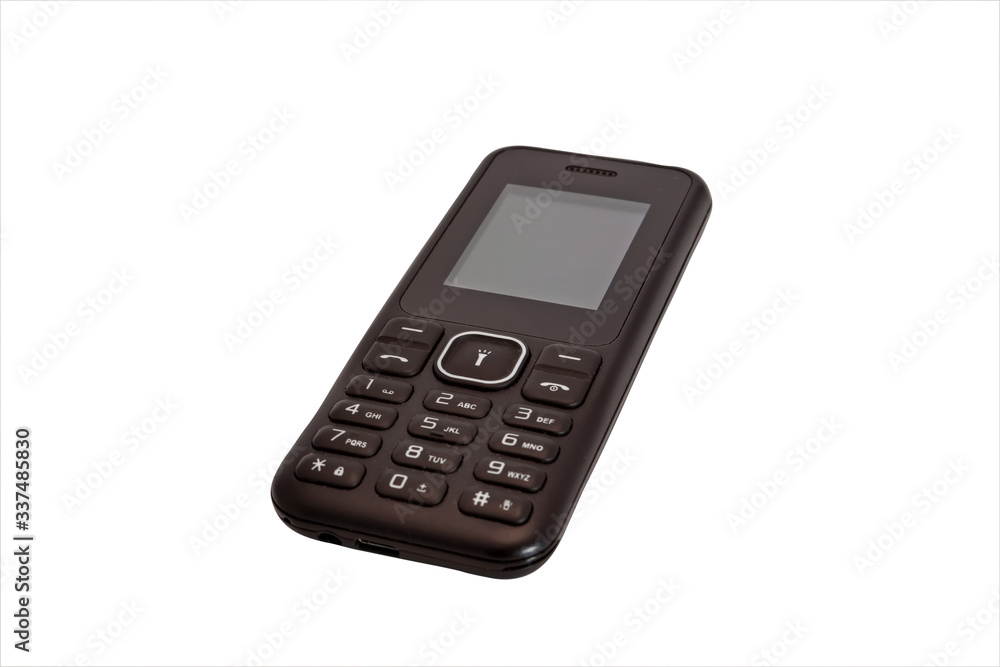 Push-button mobile phone black color isolate on a white background close-up. Push-button mobile phone black color isolate on a white background close-up.