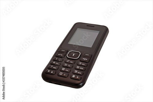 Push-button mobile phone black color isolate on a white background close-up.