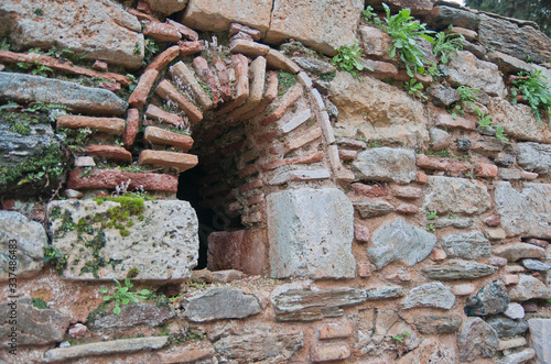 Ruins of ancient monastery of Kesariani in mountains near Athens, Greece photo