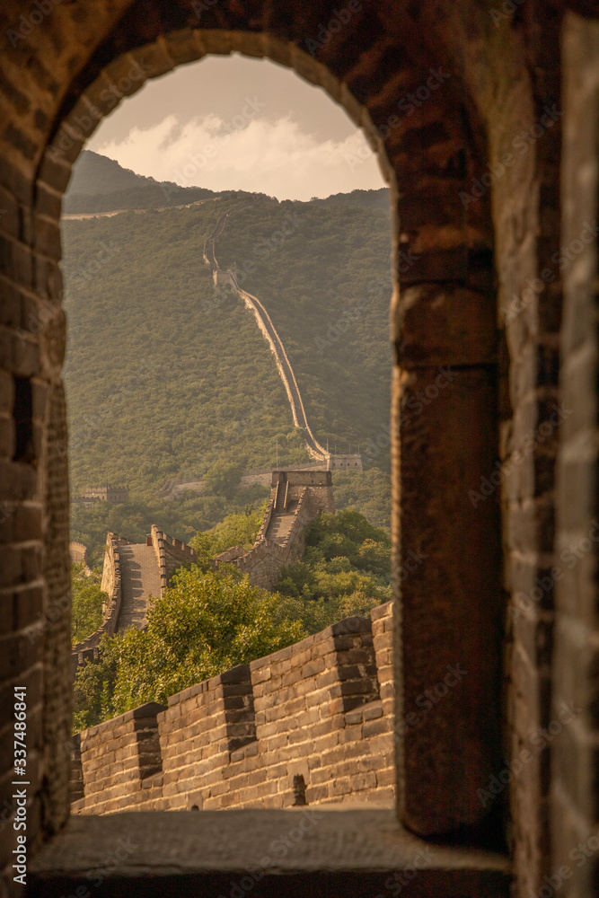 Peeking through a doorway of one of the 25,000 watch towers of the Great Wall of China near Beijing, China.