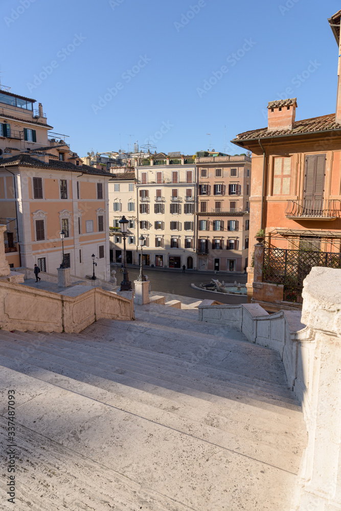 A man climbs up the popular Spanish Steps, deserted following the global coronavirus pandemic confinement