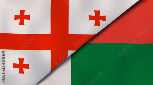 The flags of Georgia and Madagascar. News, reportage, business background. 3d illustration photo