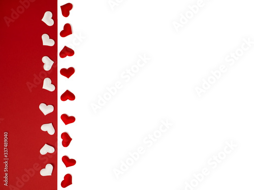 many red hearts in a row on a white isolated background. White hearts on a bright red background. Cover, postcard