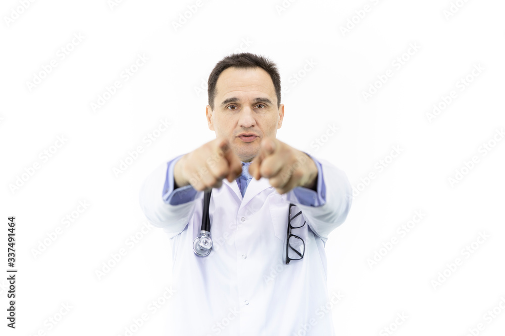 Middle-aged handsome doctor in white coat and stethoscope pointing with finger in front of himself to camera and to you, patient responsibility concept, isolated white background Middle-aged handsome doctor in white coat and stethoscope pointing with finger in front of himself to camera and to you, patient responsibility concept, isolated white background