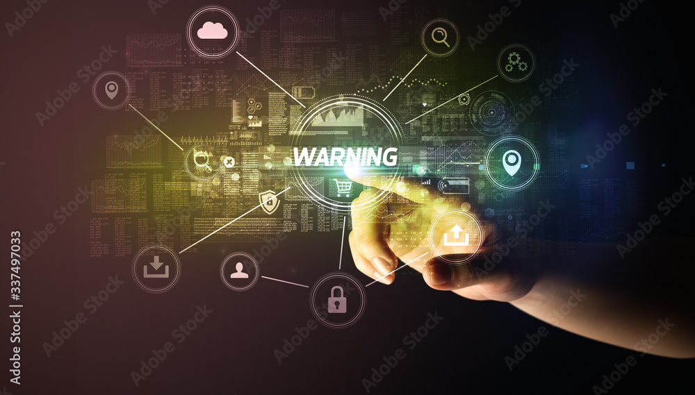 Hand touching WARNING inscription, Cybersecurity concept Hand touching WARNING inscription, Cybersecurity concept