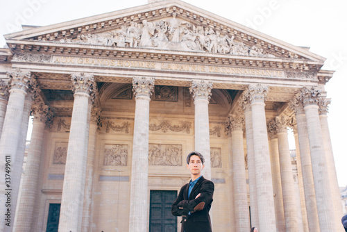 a young man stands on the square in front of the Pantheon, Paris © Aleksei Zakharov