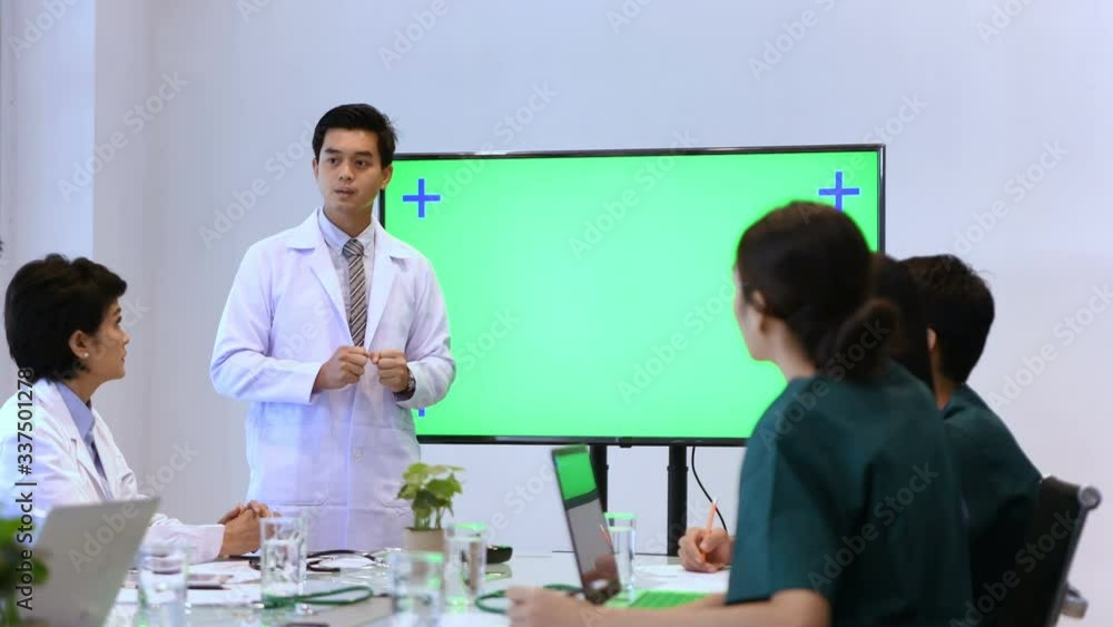 Medical concept. The doctor is explaining the meeting by previewing on a green screen. 4k Resolution. Medical concept. The doctor is explaining the meeting by previewing on a green screen. 4k Resolution.