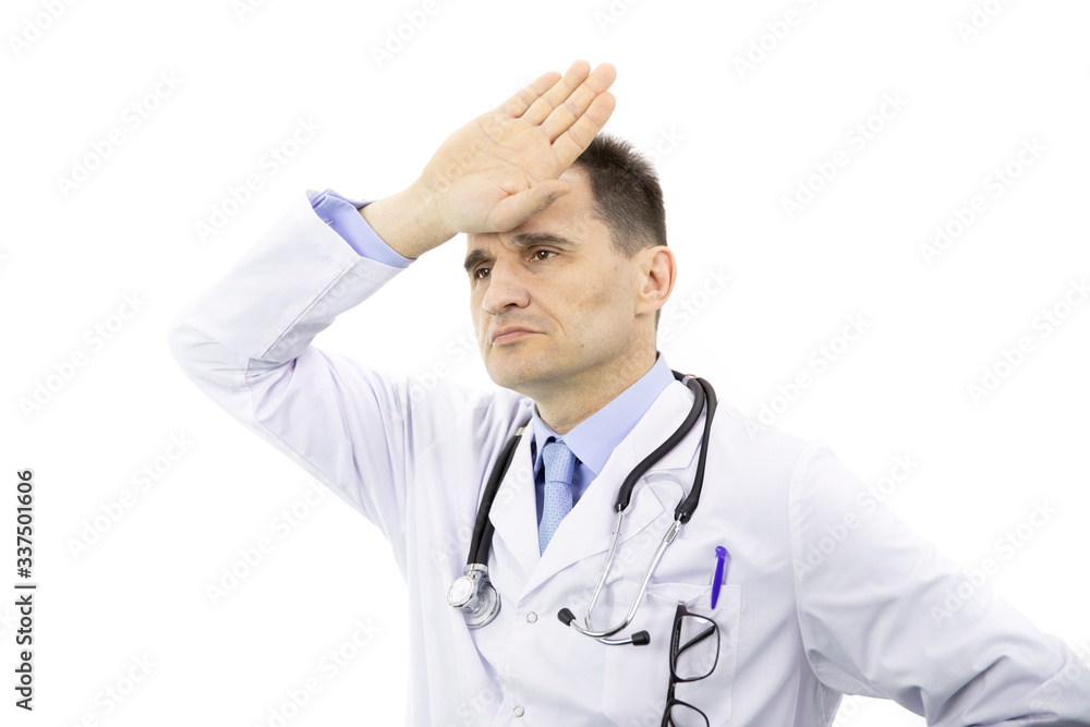 Portrait of adult physician man with glasses in chest pocket wearing medical gown and stethoscope over isolated white background tired put palm to forehead feeling fatigue and headache. Stress concept Portrait of adult physician man with glasses in chest pocket wearing medical gown and stethoscope over isolated white background tired put palm to forehead feeling fatigue and headache. Stress concept