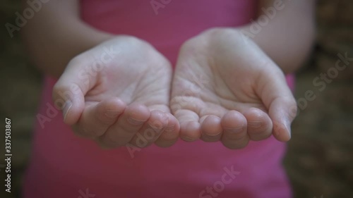 Holding out empty child hand.