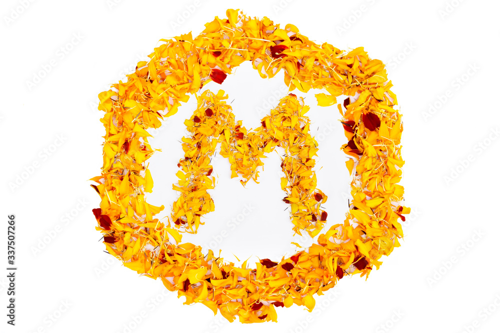 Letter M In Spring Flower Petal Hexagon. Marigold petal alphabet isolated on white background. Letter M In Spring Flower Petal Hexagon. Marigold petal alphabet isolated on white background.