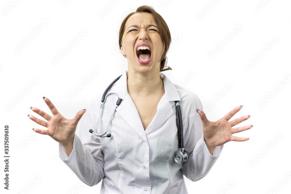 Beautiful young female doctor in white medical coat and stethoscope crazy and mad shouting and yelling with aggressive expression and arms raised. Frustration concept, isolated white background Beautiful young female doctor in white medical coat and stethoscope crazy and mad shouting and yelling with aggressive expression and arms raised. Frustration concept, isolated white background