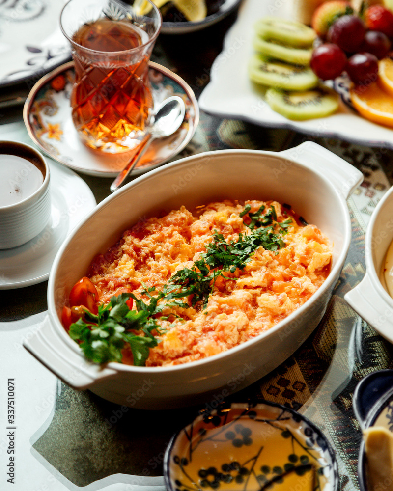 fried eggs with tomato with tea in armudu glass fried eggs with tomato with tea in armudu glass