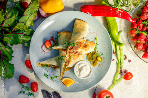 Traditional Mexican Food - Burrito, on white wooden retro table