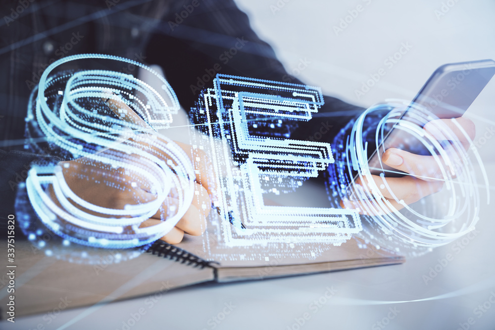 Double exposure of SEO sketch hologram and woman holding and using a mobile device. Double exposure of SEO sketch hologram and woman holding and using a mobile device.