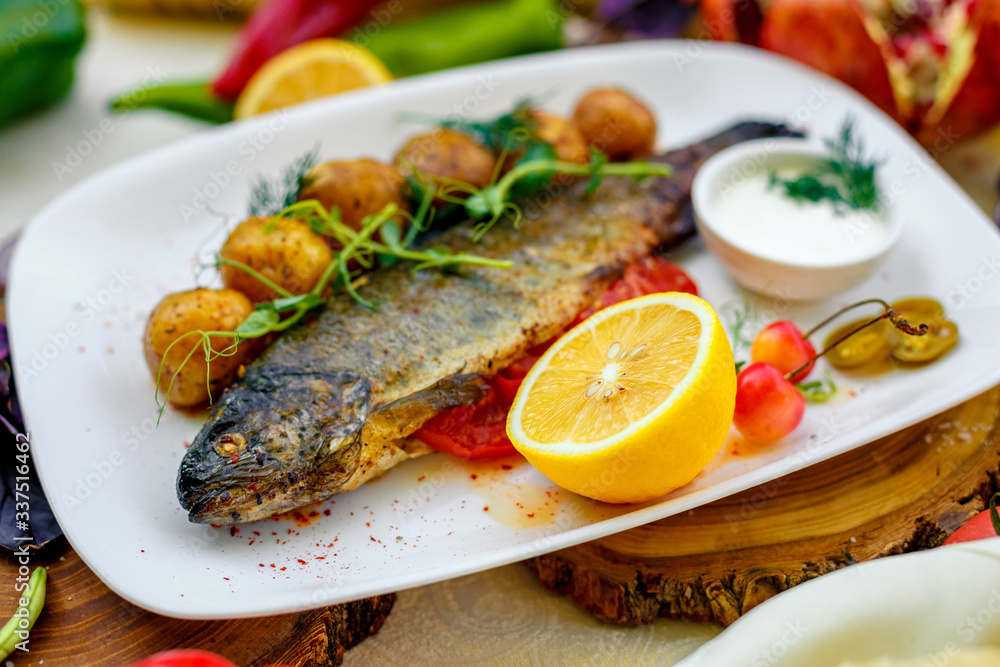 Grilled trout with potato sauce and tomato sauce and jalapeno Grilled trout with potato sauce and tomato sauce and jalapeno