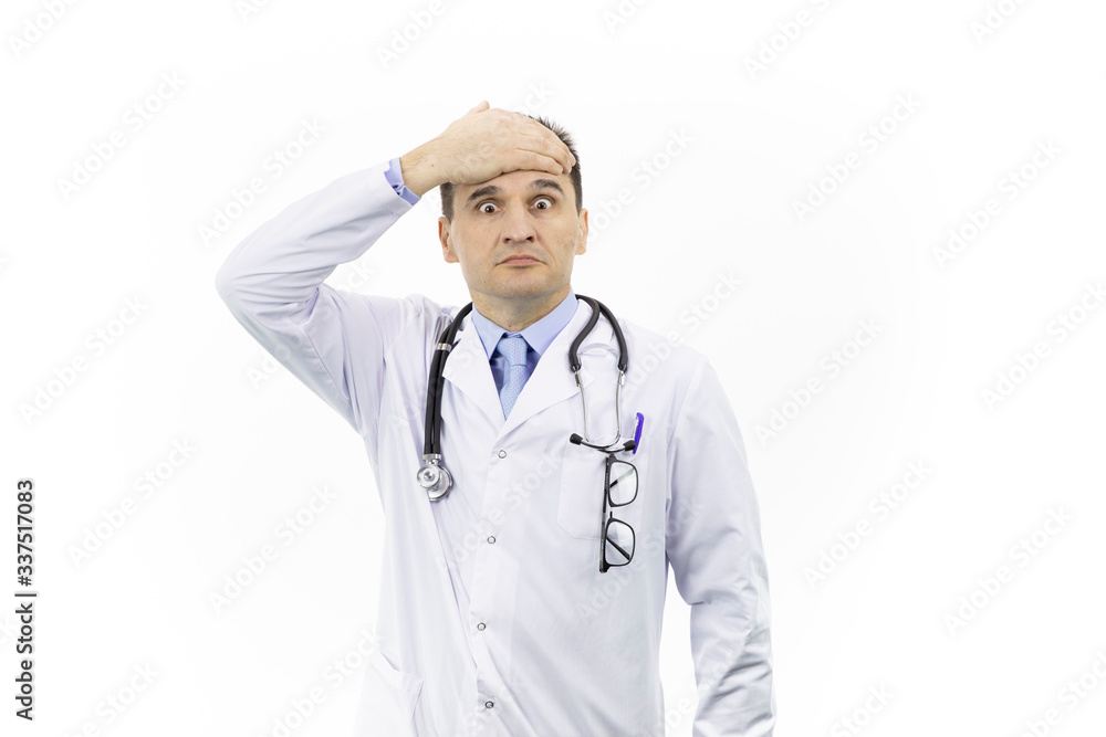 Middle-aged handsome doctor in white coat and stethoscope looking scared and shocked covering forehead with hand because of mistake and problem, isolated white background. Hard medical work concept Middle-aged handsome doctor in white coat and stethoscope looking scared and shocked covering forehead with hand because of mistake and problem, isolated white background. Hard medical work concept