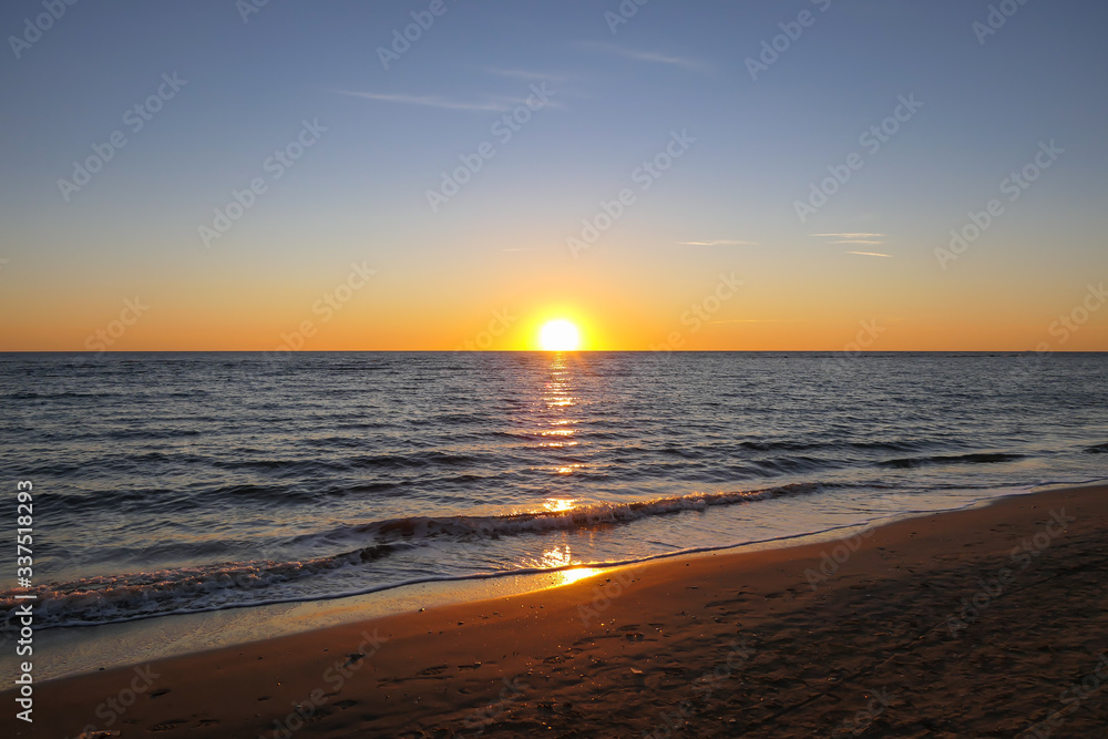 Obraz premium Sunset seascape during winter at Ostia beach (Rome, Italy, Europe).