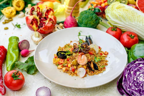ice risotto with seafood, mussels, shrimps and vegetables, healthy food