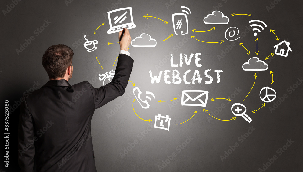 businessman drawing social media icons with LIVE WEBCAST inscription, new media concept businessman drawing social media icons with LIVE WEBCAST inscription, new media concept