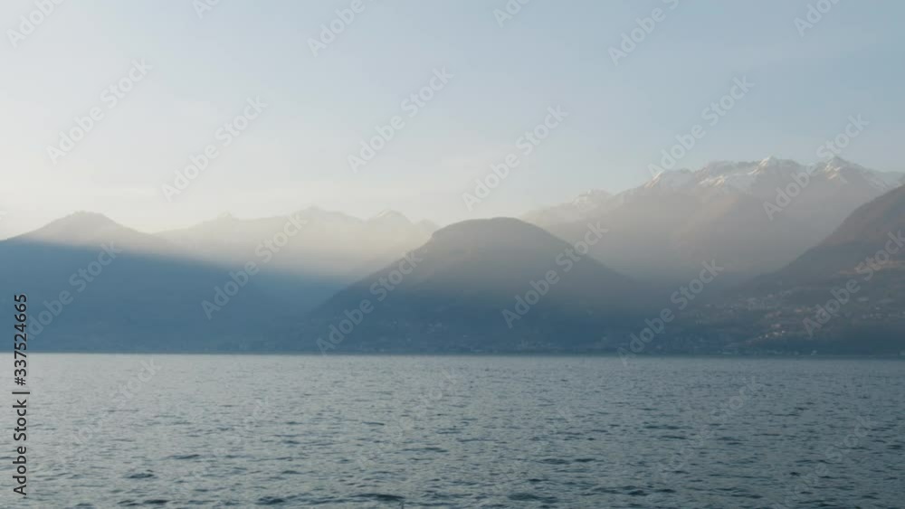 Light Ray on Mountains Near a Lake at Sunset Light Ray on Mountains Near a Lake at Sunset