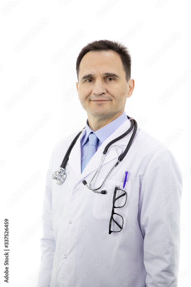 Portrait of a Caucasian adult doctor in a white coat with a stethoscope on his neck on a white background. Smiling and looking at the camera. The model is half a turn to the camera. Close-up. Portrait of a Caucasian adult doctor in a white coat with a stethoscope on his neck on a white background. Smiling and looking at the camera. The model is half a turn to the camera. Close-up.