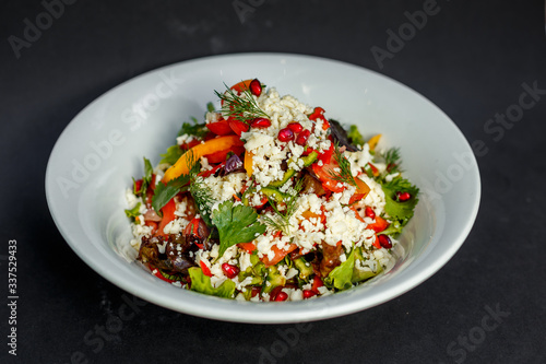 vegetarian salad healthy food with pomegranate cheese and pepper
