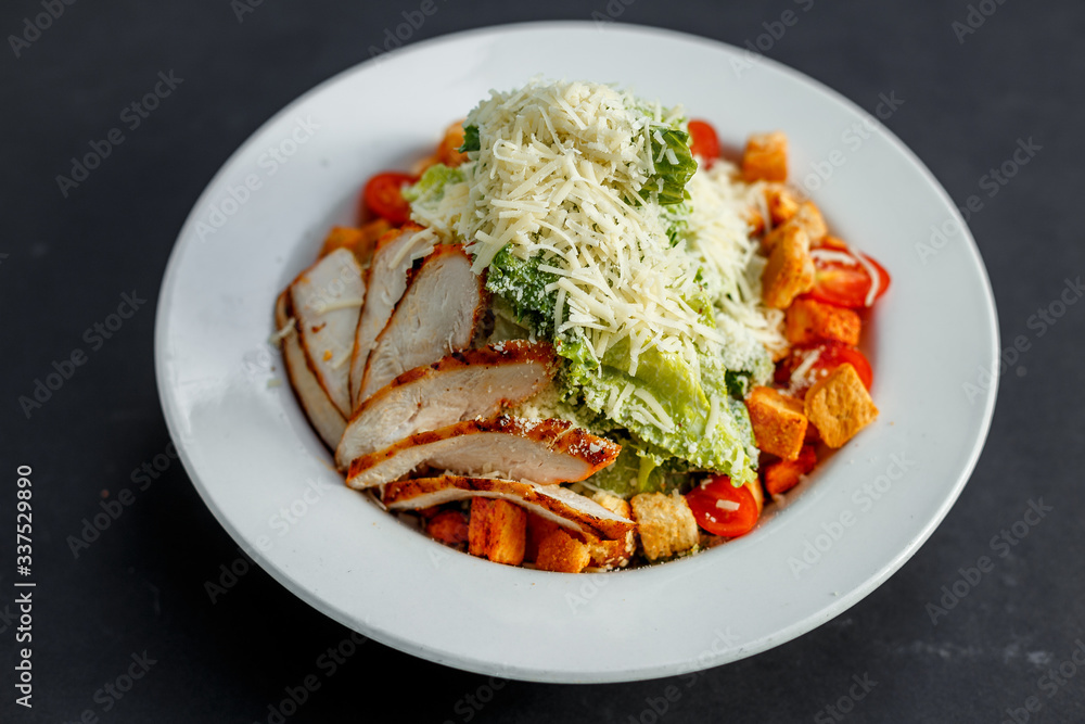 Caesar salad with chicken and crackers Caesar salad with chicken and crackers