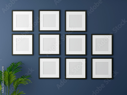 Blank picture frame mock up on the blue wall. 3d rendering.