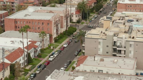 AERIAL: Typical Houses , Apartments , Residential Area in West Hollywood, California with Beautiful Rich colors in Trees and Buildings  photo