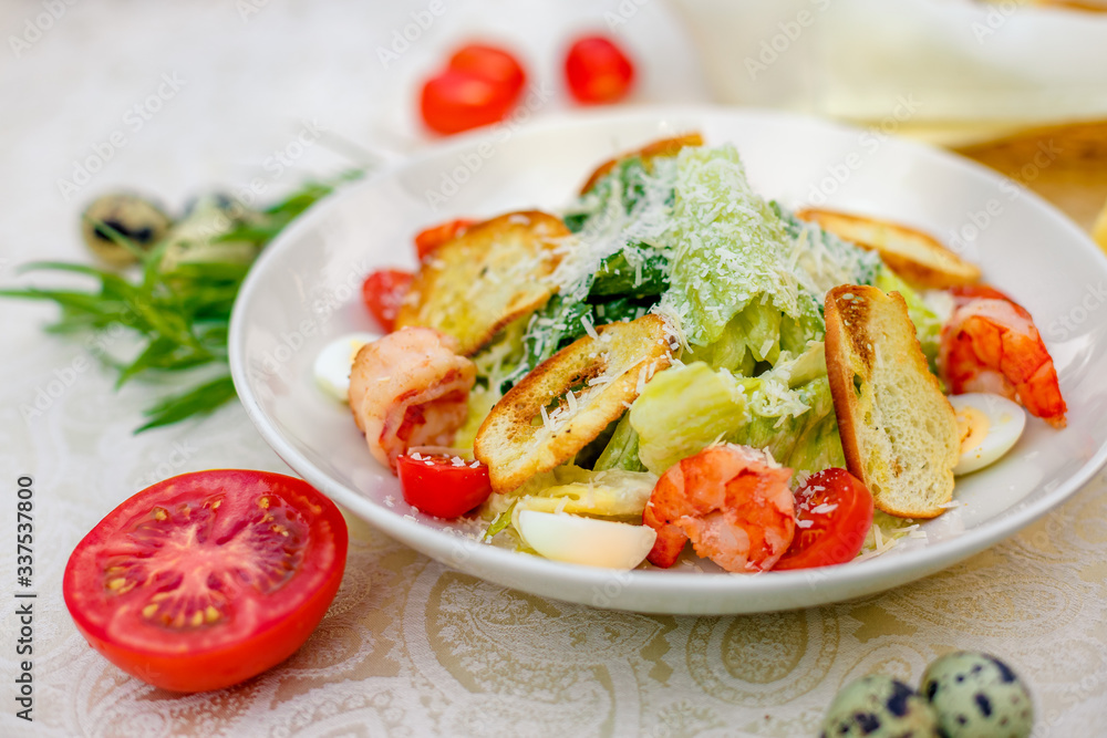 Caesar salad with seafood vegetables and herbs, healthy food on the table Caesar salad with seafood vegetables and herbs, healthy food on the table