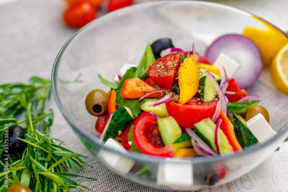 fresh vegetarian salad with greens and vegetables on the table, healthy food